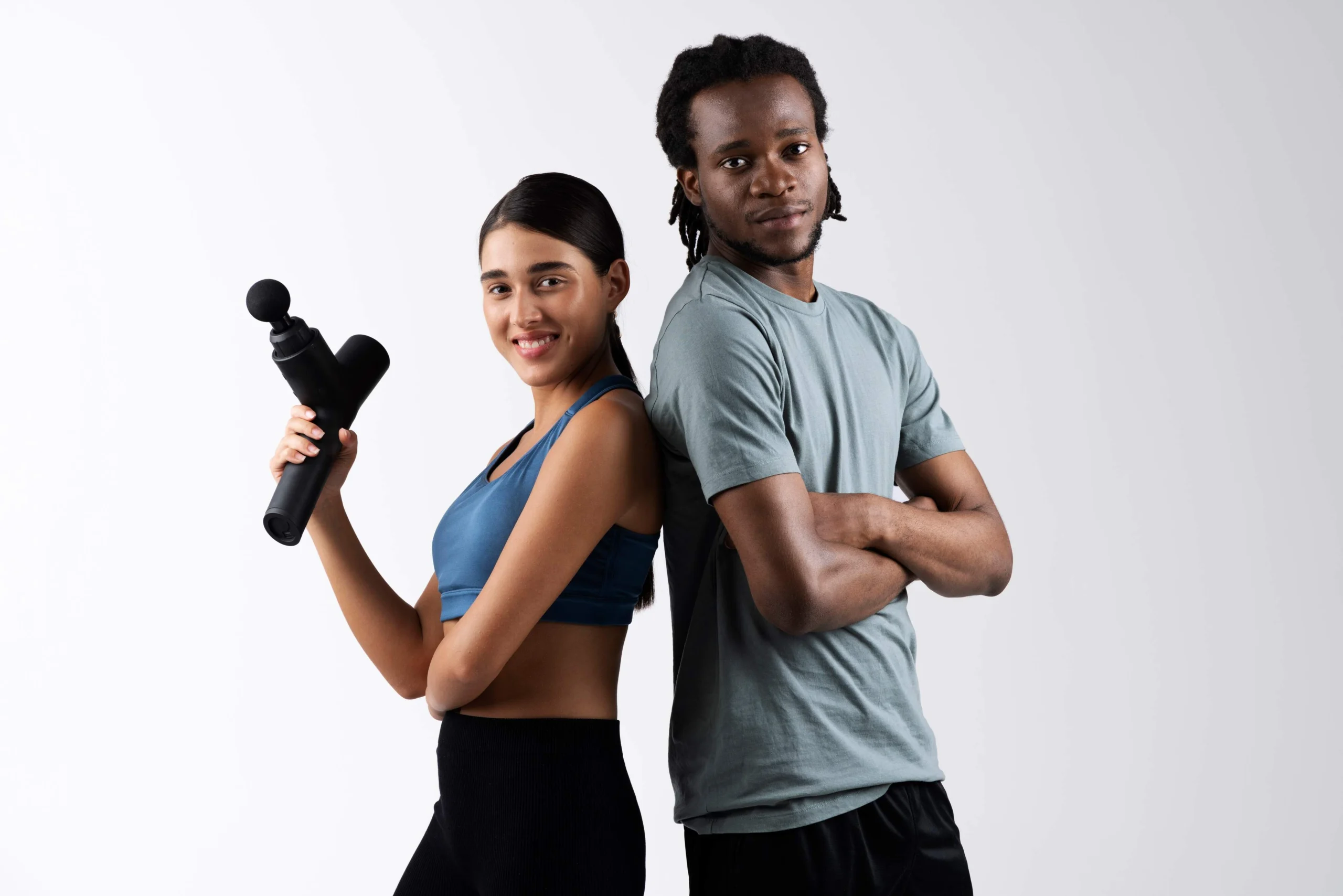 Trainer demonstrating hands-on recovery therapy during wellness course
